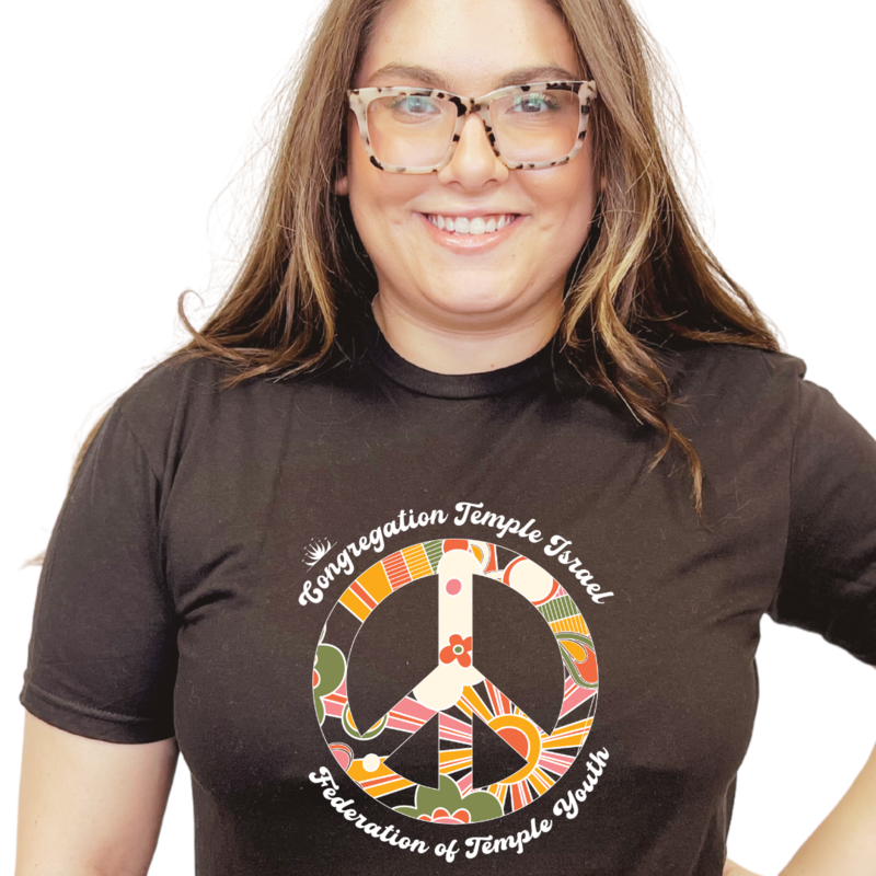Maya wearing TIFTY peace sign t-shirt